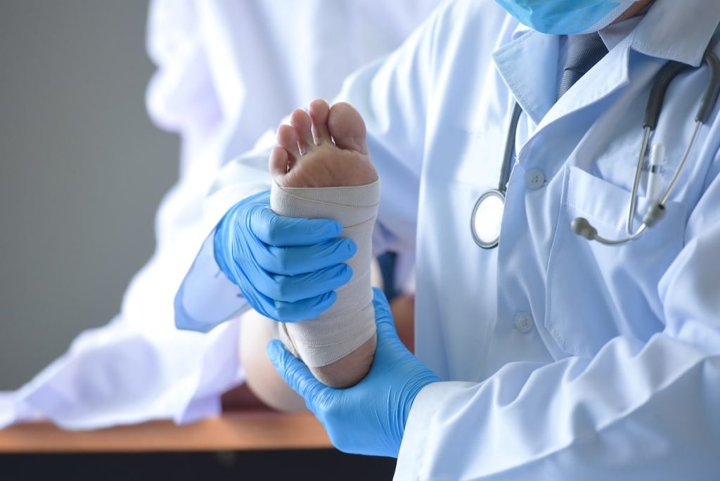 heel pain bandaging and injured foot.