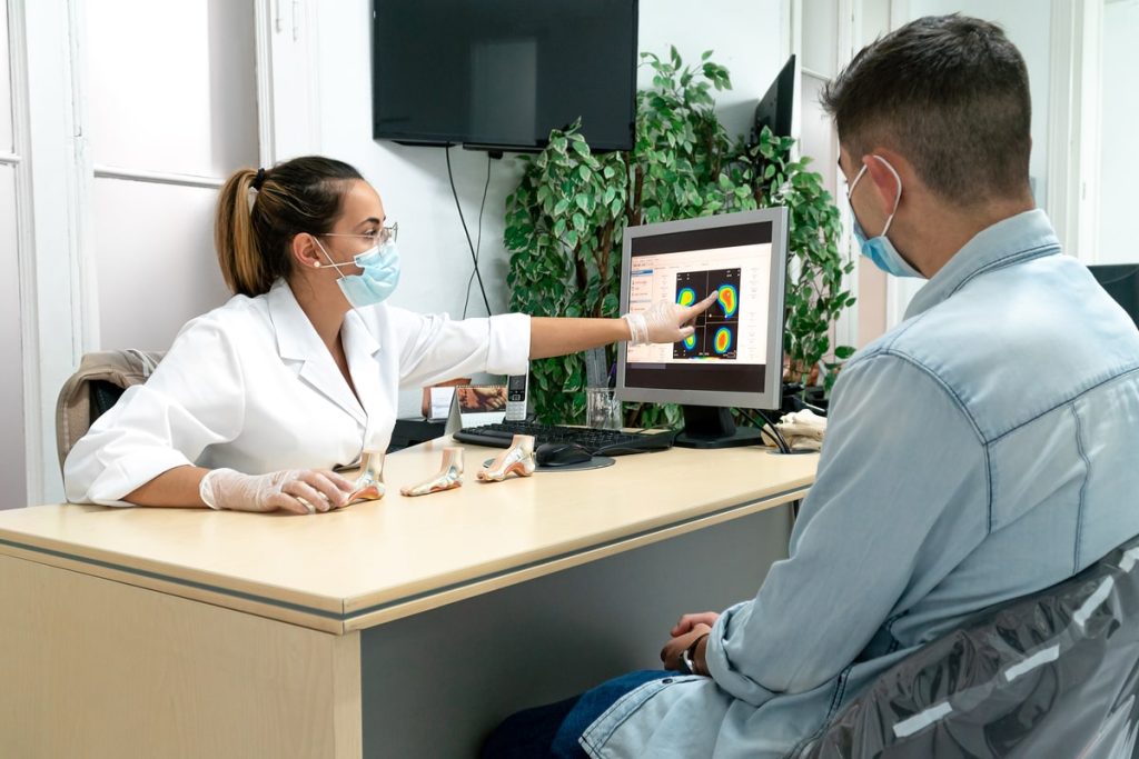 Patient in consultation with a Foot And Ankle Specialists.